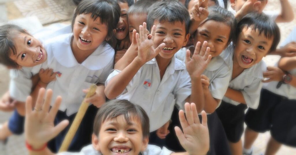 Children are raising their hand to show their joy. It is the result of value-based education.