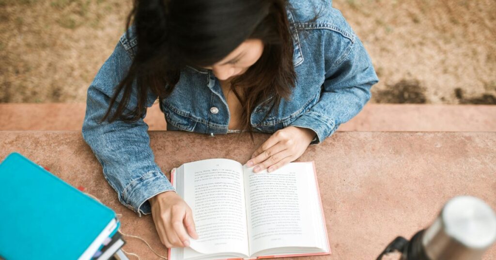 A girl is reading a book. This image shows the various learning styles