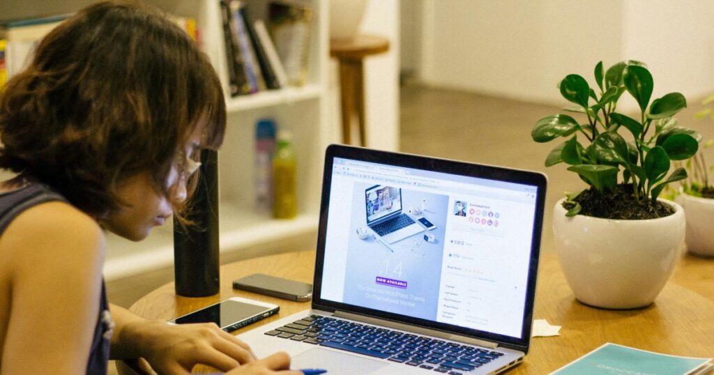 A girl is learning her lessons with the help of laptop. It is a result of motivational factors in learning