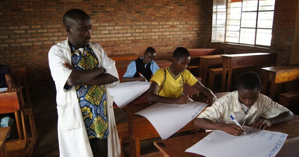 A teacher is walking through the classroom. This image shows the teacher leadership.
