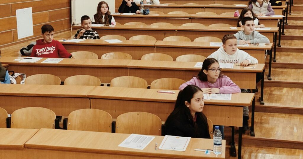 Assessment in education. An image of a examination hall.