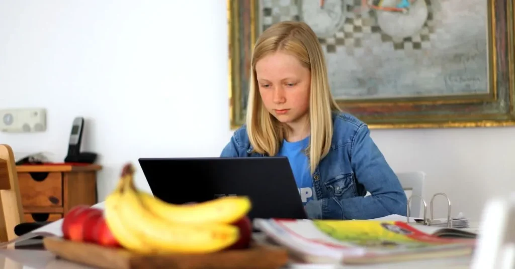 A girl is learning her course by using a computer in her home.It shows the personalized learning and the best curriculum planning