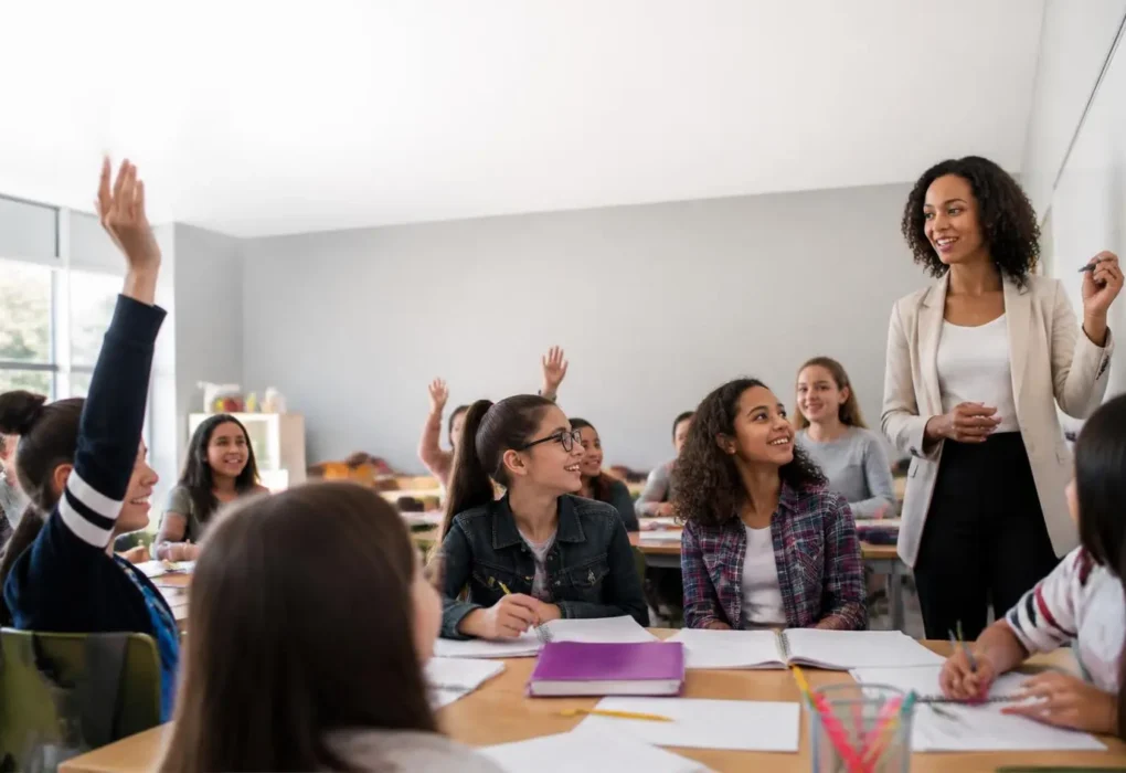 Teacher using effective teaching strategies to engage students in a modern classroom.