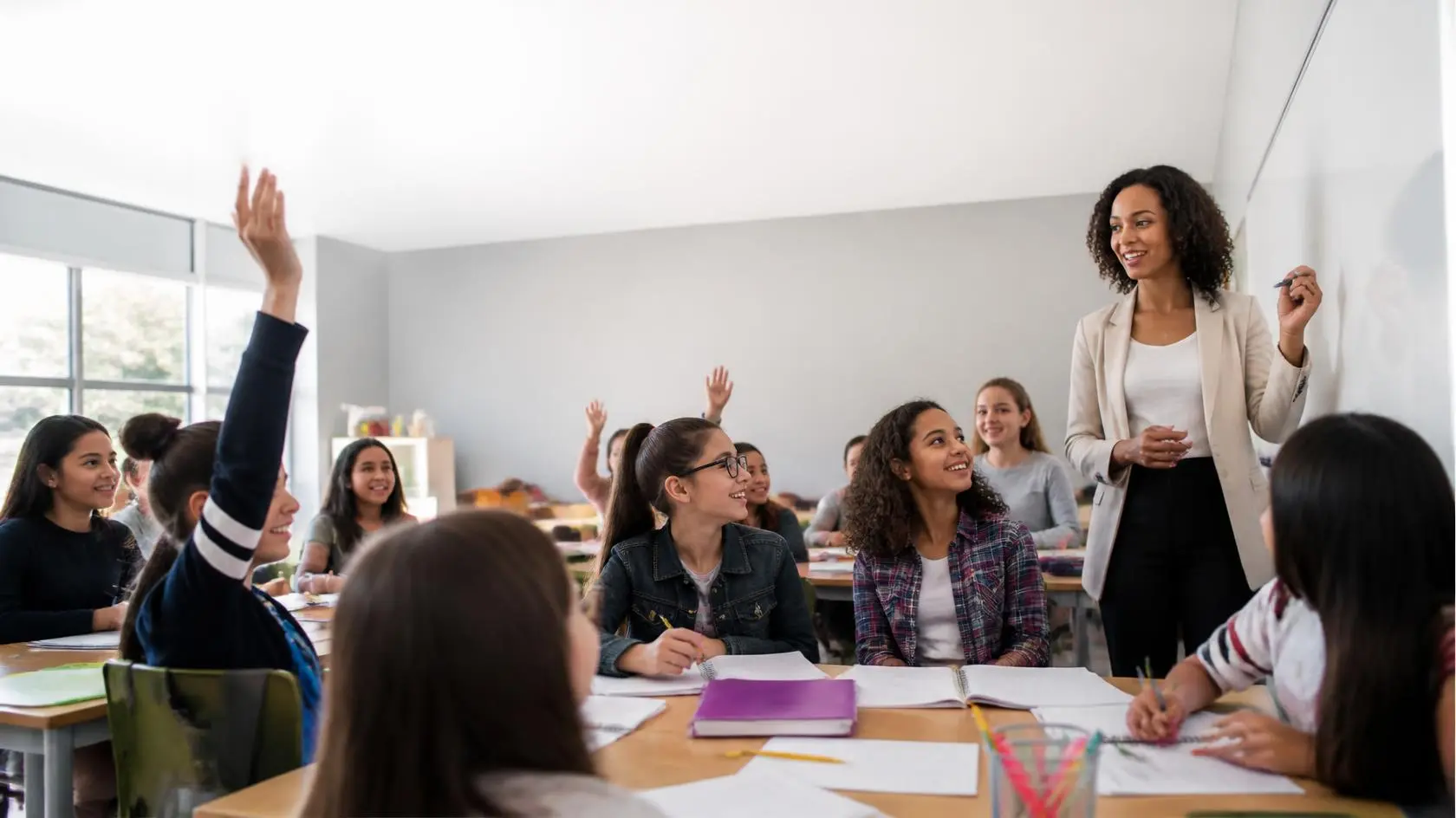 Teacher using effective teaching strategies to engage students in a modern classroom.